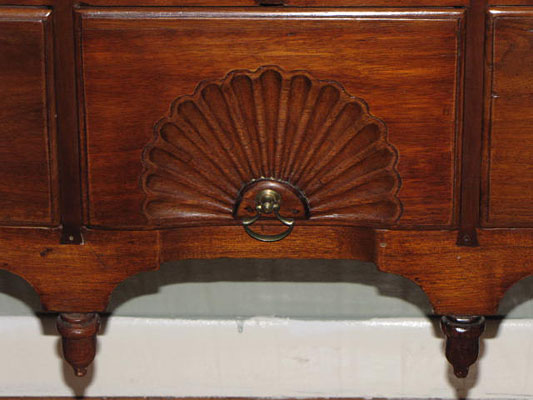 18th century Queen Anne Lowboy with fan carving, acorn drops, and dovetailed case with pad feet in old finish.