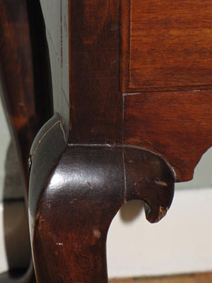 18th century Queen Anne Lowboy with fan carving, acorn drops, and dovetailed case with pad feet in old finish.