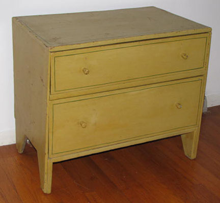 Great early painted chest with two drawers, hand carved wooden pulls, square nail construction, has unusual drawer slides that go into the back boards.